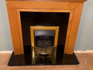 granite-fire-surround-and-hearth-with-wooden-mantelpiece